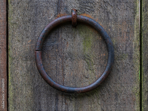 Old ring on an old wooden door.