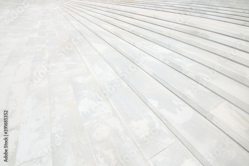 Curved steps of a sunken urban outdoor square.