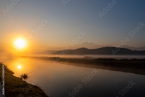 Sunrise with the mist over the river and the plain in Kayseri  in front of Erciyes mountain