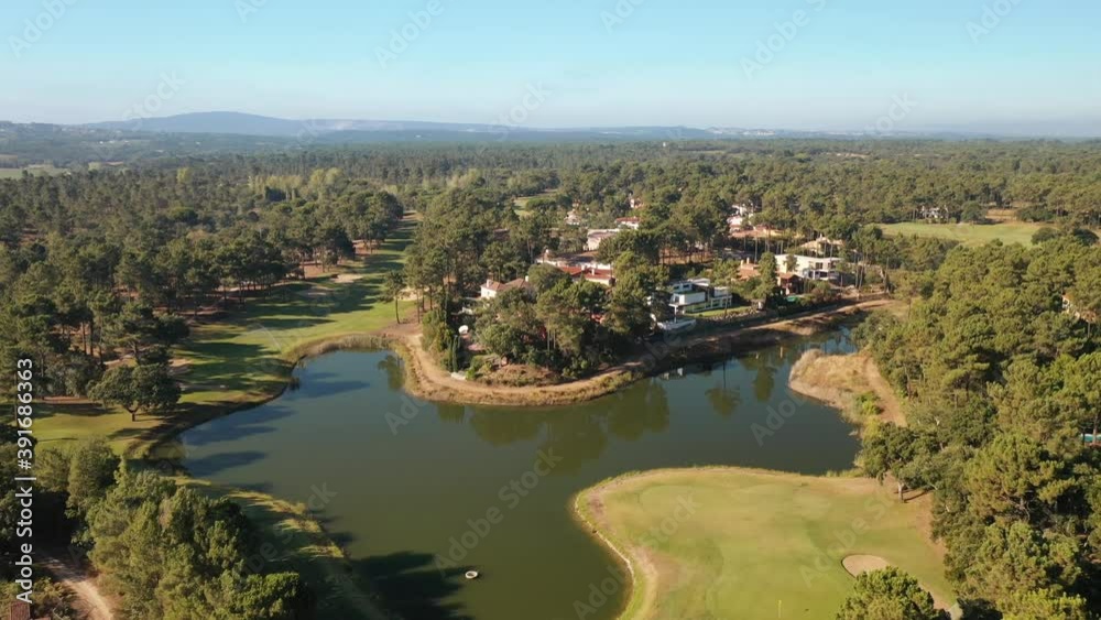 fast flight over a lake in a golf resort and residential area fast flight over a lake in a golf resort and residential area