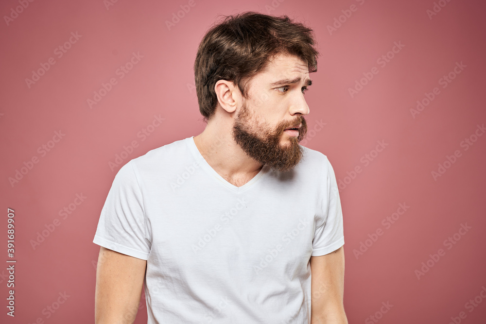 emotional man white t shirt sad facial expression pink background emotional man white t shirt sad facial expression pink background