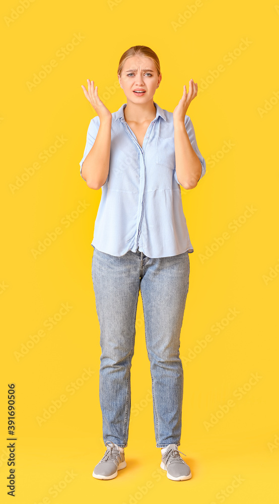 Stressed young woman on color background Stressed young woman on color background