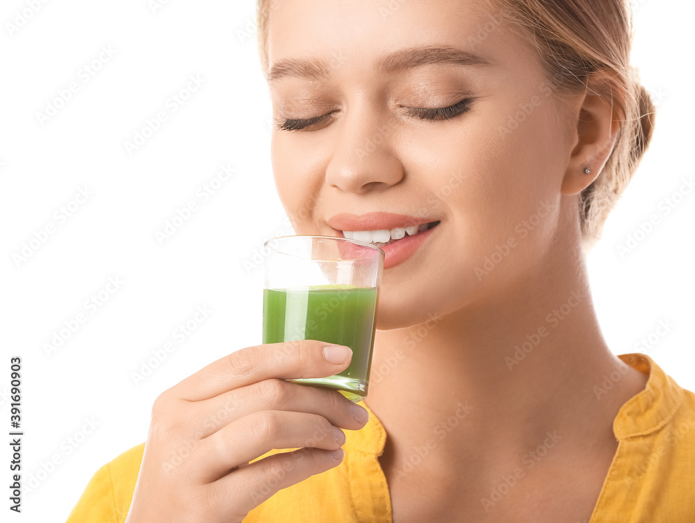 Young woman with wheatgrass juice on white background Young woman with wheatgrass juice on white background