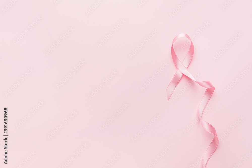 Pink ribbon on color background. Breast cancer awareness concept Pink ribbon on color background. Breast cancer awareness concept