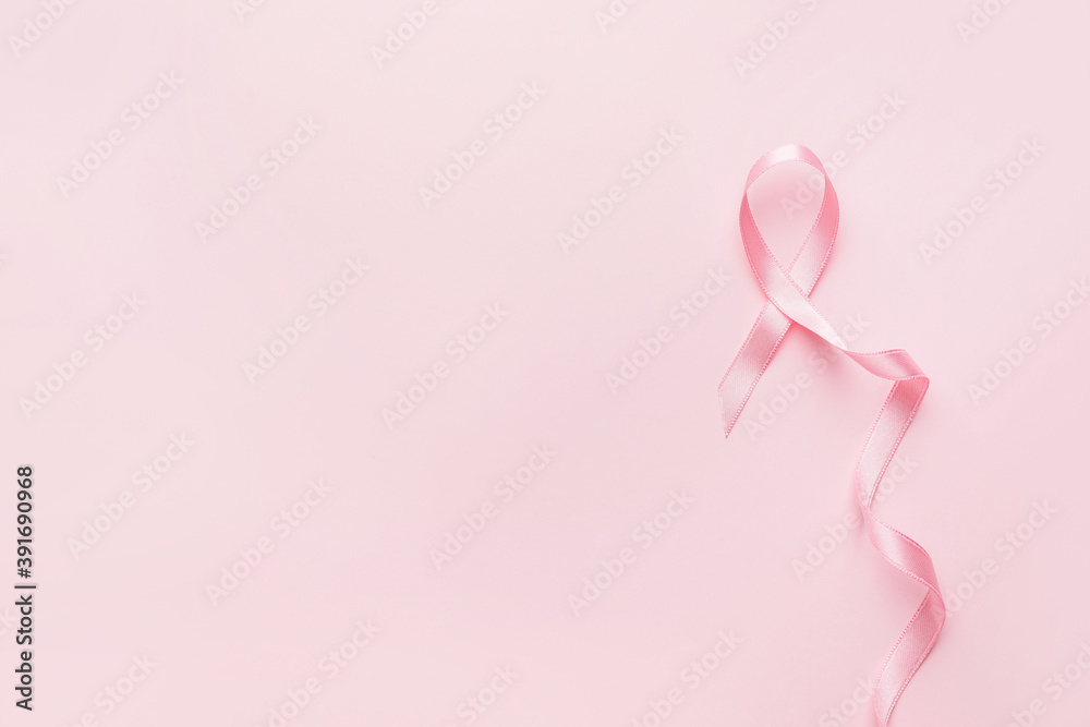 Pink ribbon on color background. Breast cancer awareness concept