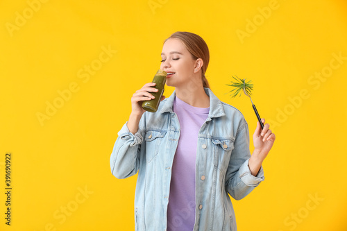 Young woman with wheatgrass...