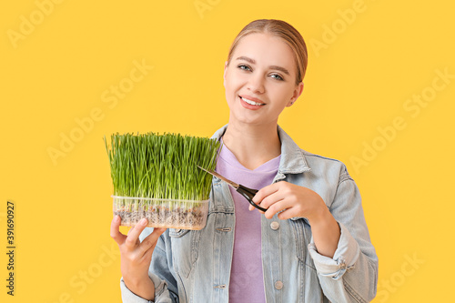 Young woman with wheatgrass...