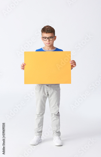 Little boy with blank paper...