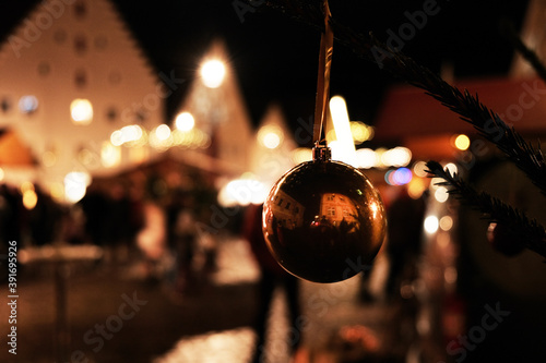 Christmas  in Europe.Christmas festive market in Germany.festive glowing Christmas decorations in the evening city.Winter Holidays.Traditional festive European Christmas event.