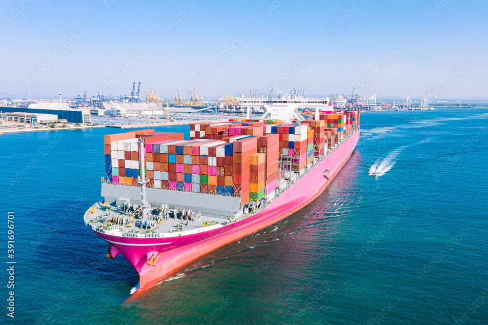 Fototapeta premium Aerial view cargo ship of business logistic transportation sea freight,Cargo ship, Cargo container in factory harbor at industrial estate for import export around in the world, Trade Port / Shipping 