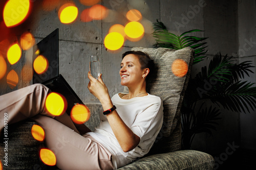 A woman celebrates the Christmas and New Year with friends and relatives online during the pandemic