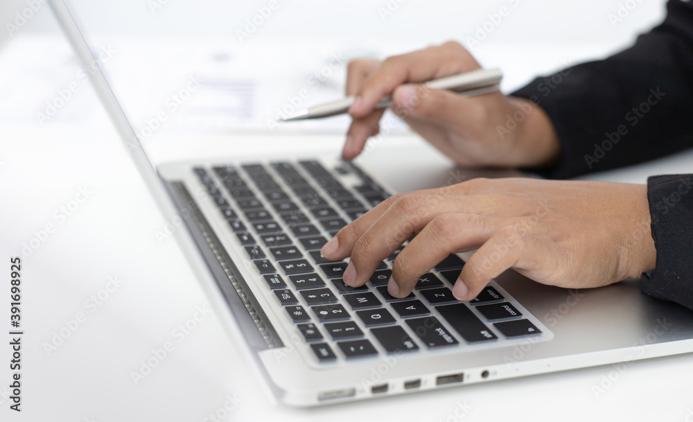 Financial businesswomen use laptop to analyze marketing strategies and real estate data to reduce company taxes for their customers, Accounting and Tax concept. Financial businesswomen use laptop to analyze marketing strategies and real estate data to reduce company taxes for their customers, Accounting and Tax concept.