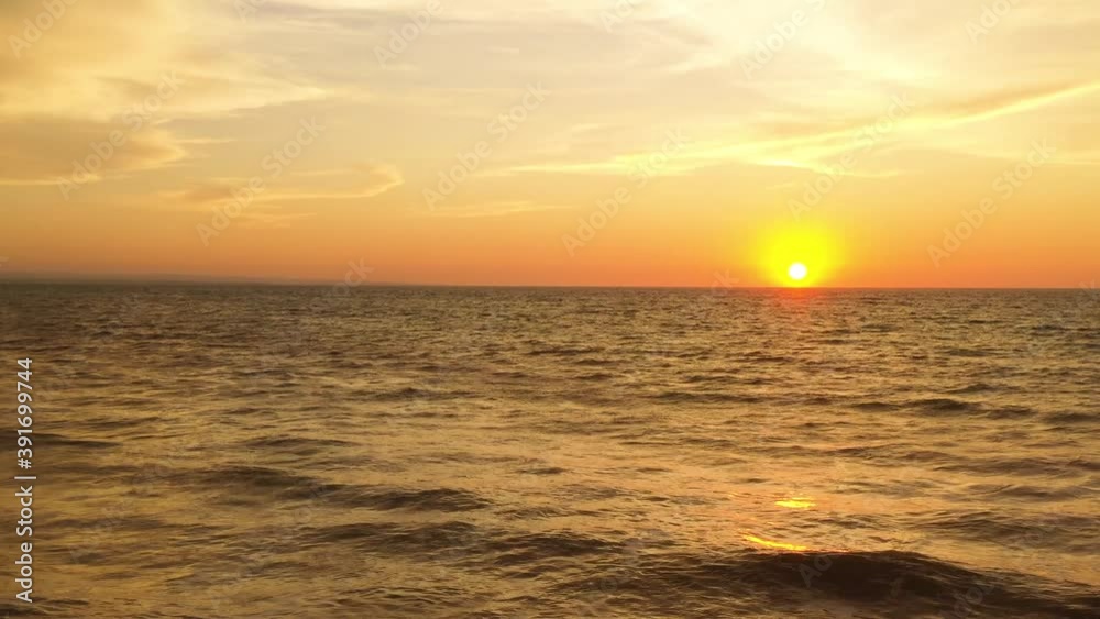 Aerial shot with sunset or sunrise at ocean with waves. Stunning beautiful aerial drone image of a red tropical sunset above the sea ocean. Crucita, Manabí, Ecuador. Aerial shot with sunset or sunrise at ocean with waves. Stunning beautiful aerial drone image of a red tropical sunset above the sea ocean. Crucita, Manabí, Ecuador.