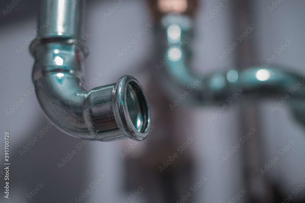 Detail of a metal heating pipe on a bend. Visible rubber seal and place to crimp the tube. Detail of a metal heating pipe on a bend. Visible rubber seal and place to crimp the tube.