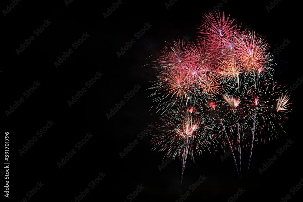 Colorful sparkle light fireworks celebration on black night background with copy space.