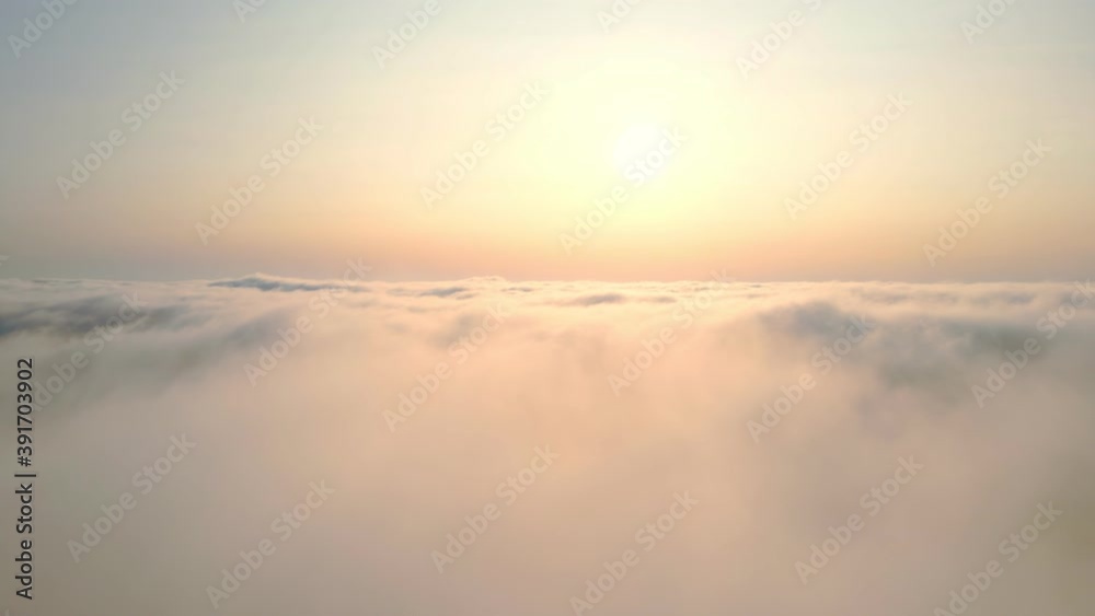 sunset over the clouds. Flying over the clouds at sunset. sunset over the clouds. Flying over the clouds at sunset.