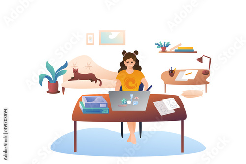 The woman draws with a stylus on a graphics tablet. Cozy office at home, remoteworking as a home designer. A girl designer is sitting at a work table. Cat on the sofa.