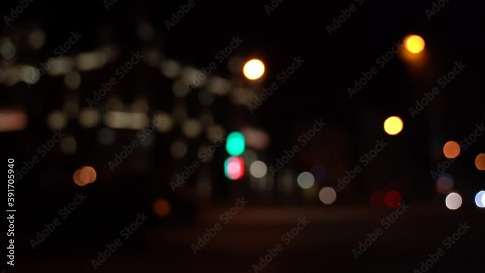 The blurred movement of the vehicle, the side on the road at night in a big city. The blurred movement of the vehicle, the side on the road at night in a big city.
