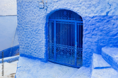 Old bars in house in Medina of Chefchaouen (Chaouen), Morocco. The city is noted for its buildings in shades of blue and that makes Chefchaouen very attractive to visitors. © Renar