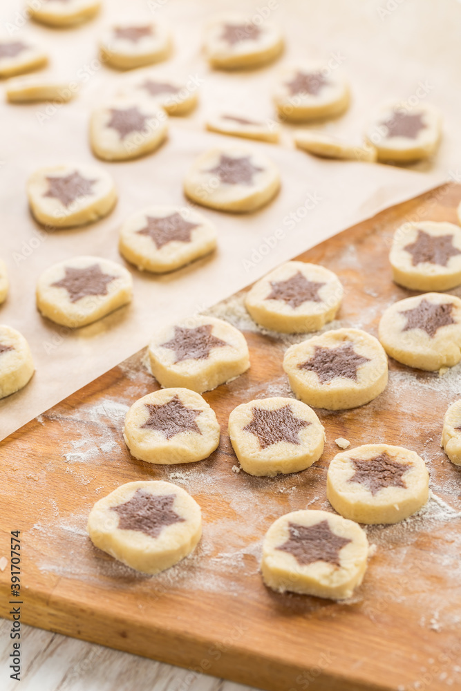 Baking christmas cookies with chocolate star.