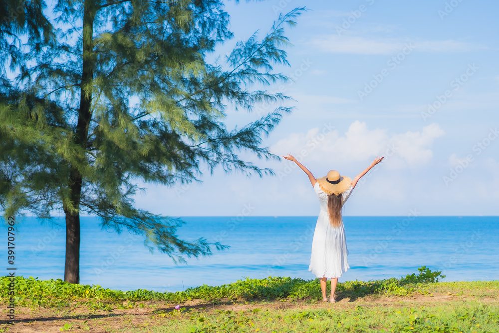 Portrait beautiful young asian woman relax smile around beach sea ocean with blue sky white cloud Portrait beautiful young asian woman relax smile around beach sea ocean with blue sky white cloud