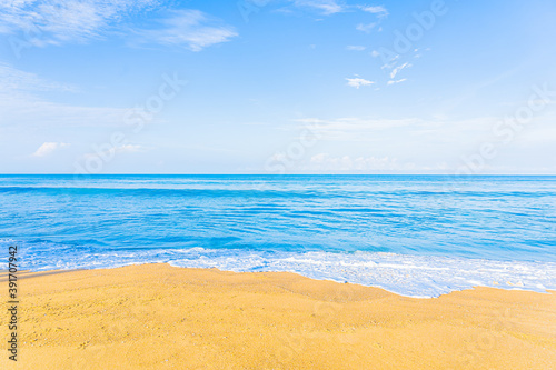 Beautiful tropical beach sea ocean with blue sky and white cloud