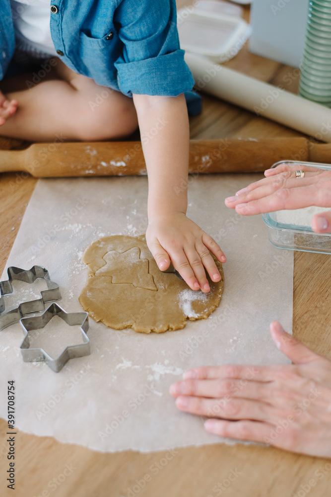 Mother and daughter preparing christmas cookies, tree shape Mother and daughter preparing christmas cookies, tree shape