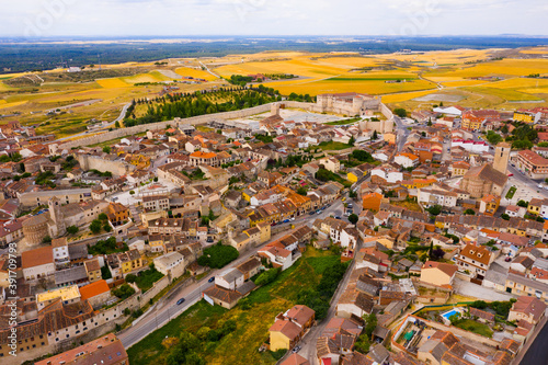 Fotografiet Scenic view from drone of Cuellar cityscape with medieval Castle of Dukes of Alb