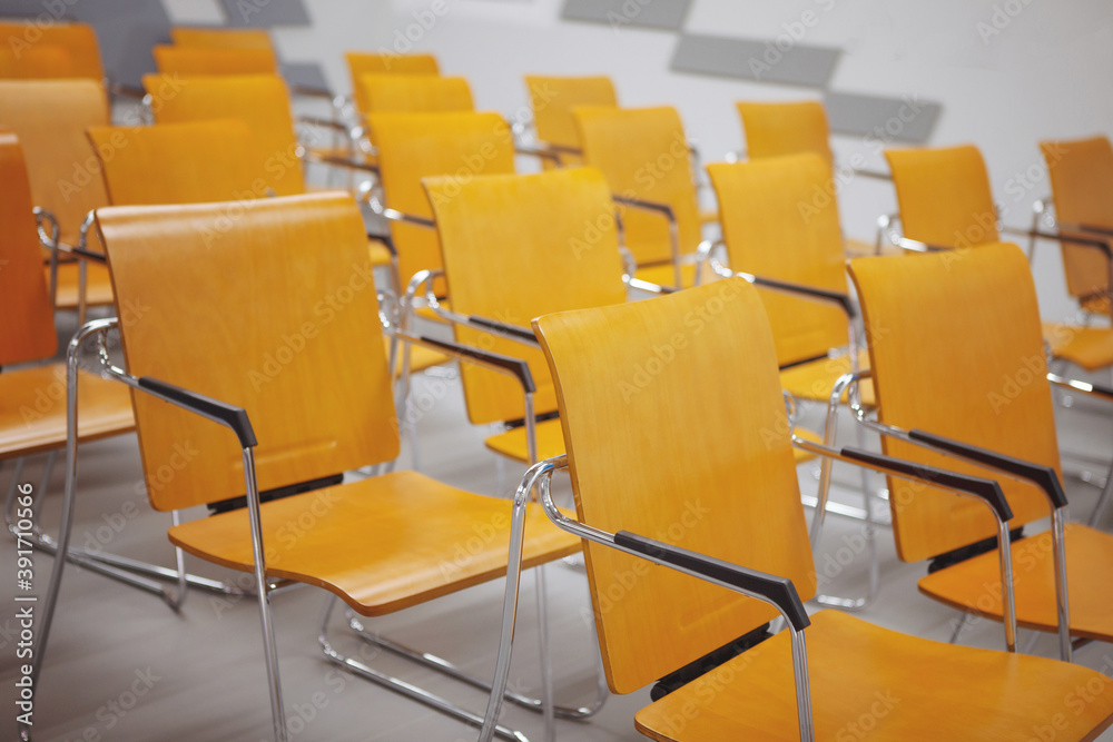Fototapeta premium Row of yellow chairs