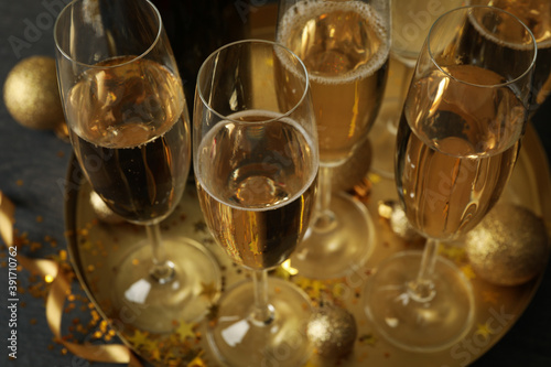 Tray with champagne glasses and glitter, close up