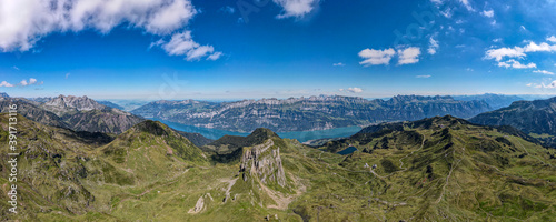 Sächsmoor with the Wallensee and a beautiful mountain chain in the background on a sunny day in Flums Switzerland - Drone Perspective Landscape Photography
