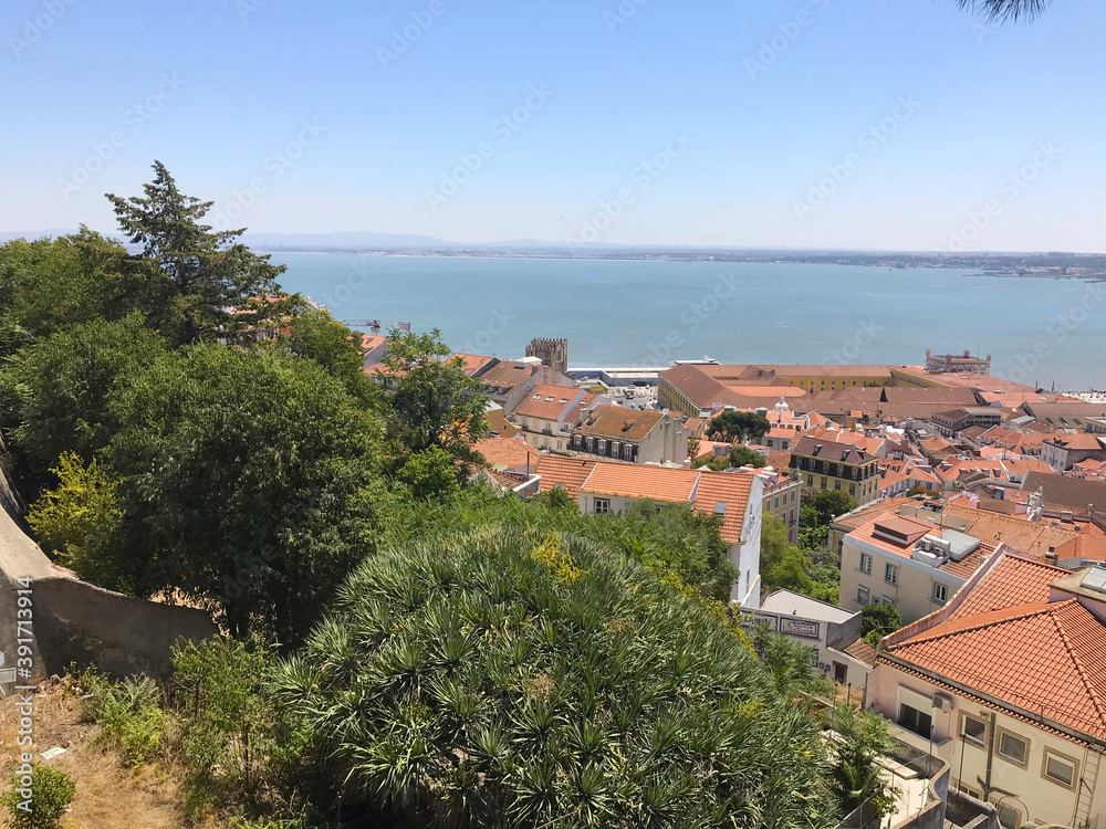 Aerial view of red roofs of Alfama and the River Tagus in Lisbon Portugal