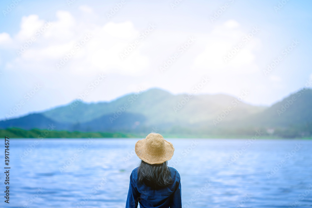portrait woman on sea landscape with mountain  relax and calm in sunny day concept summer, alone, travel vacation, relaxing, positive thinking