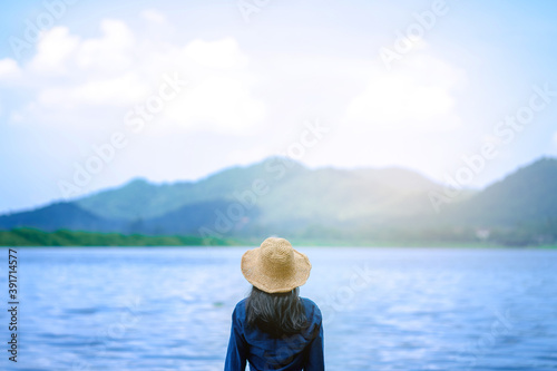 portrait woman on sea landscape with mountain  relax and calm in sunny day concept summer, alone, travel vacation, relaxing, positive thinking