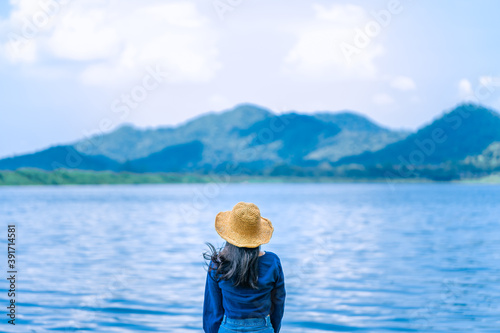 portrait woman on sea landscape with mountain  relax and calm in sunny day concept summer, alone, travel vacation, relaxing, positive thinking