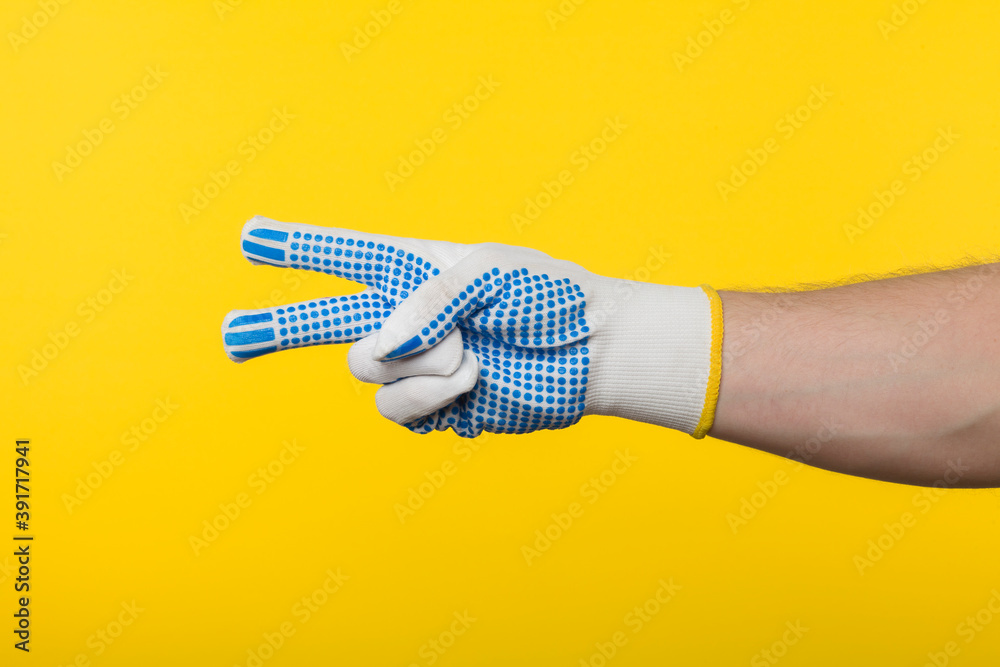 Worker work glove isolated on yellow background