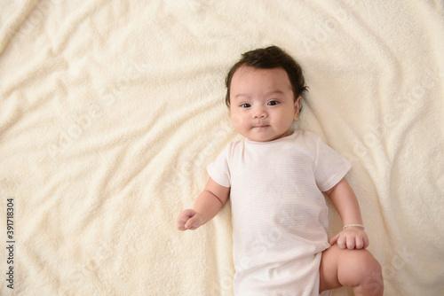 Top view of cute little Asian baby with copy space