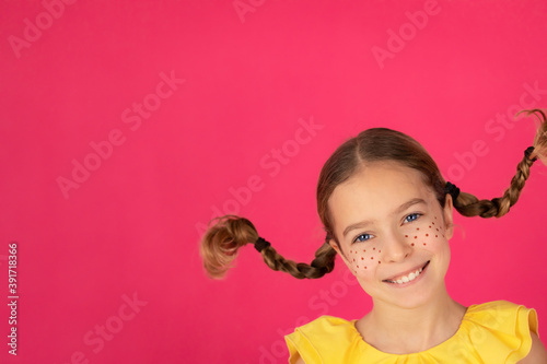 Smiling girl against pink background
