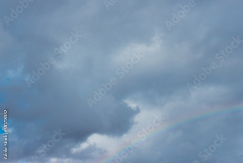 Clouds with a rainbow after the rain