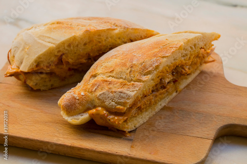 Very tasty big sandwich with meat stuffed and homemade crunchy and fluffy bread. It is a traditional portuguese pork beef sandwich 