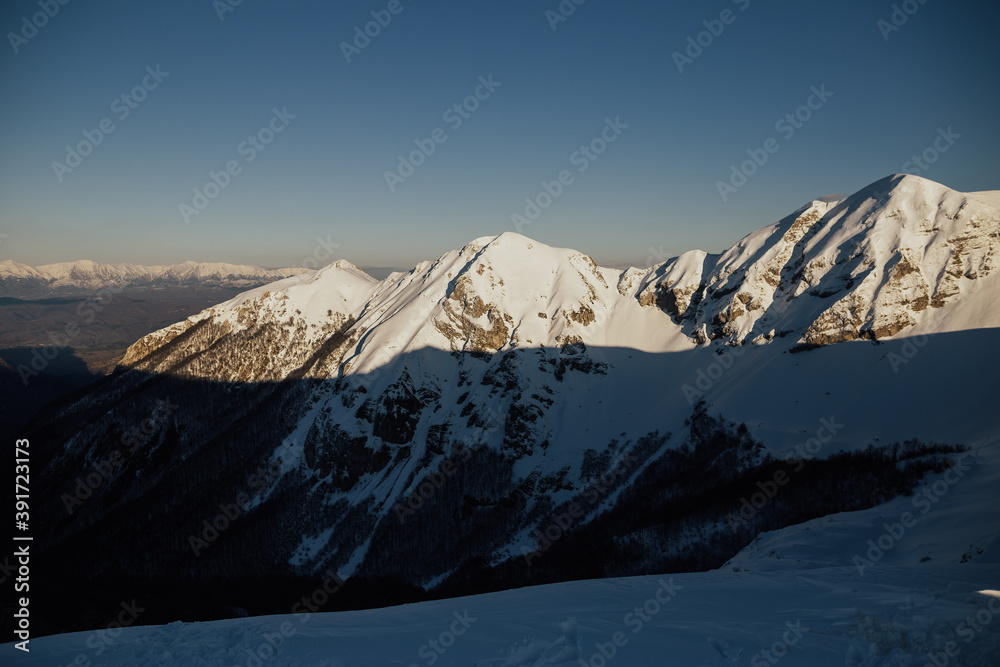 Beautiful panorama of snowy European Alps in sunny day.