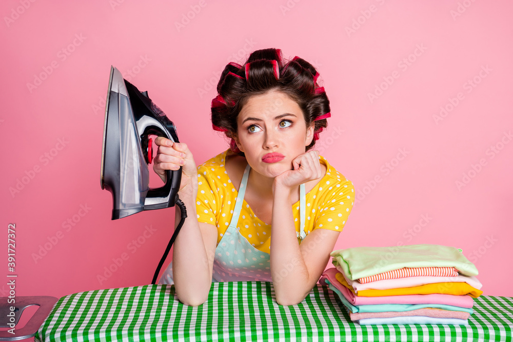 Frustrated girl tired iron board pile heap clothing touch hands