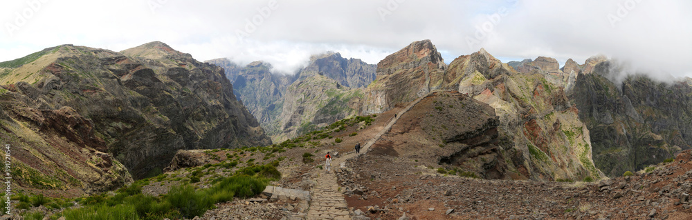 People walking the hiking trail Vereda do Areeiro near Pico Arieiro (Madeira) 