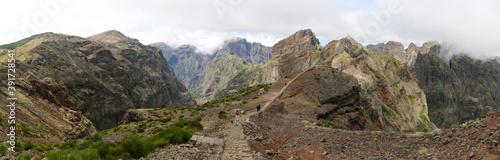 People walking the hiking trail Vereda do Areeiro near Pico Arieiro (Madeira) 