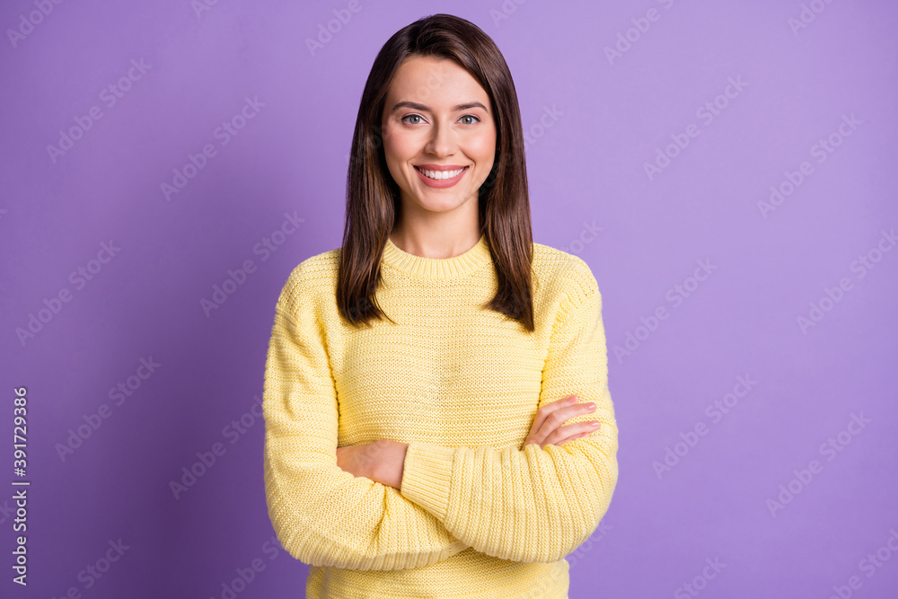 Photo portrait of young happy pretty girl smiling with crossed hands wearing yellow clothes isolated on vibrant violet background Photo portrait of young happy pretty girl smiling with crossed hands wearing yellow clothes isolated on vibrant violet background