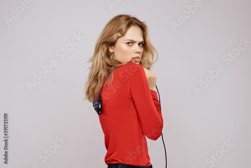 Pretty woman with gamepads playing entertainment leisure lifestyle light background