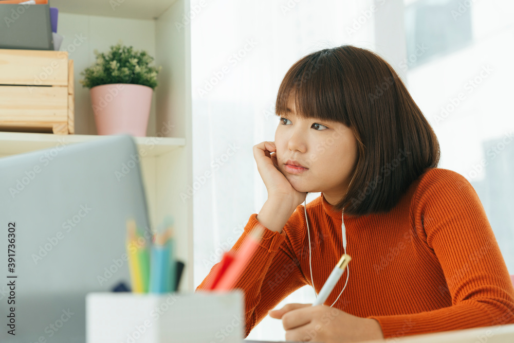 Beautiful young asian thai black short hair woman tired of study from home with laptop. Beautiful young asian thai black short hair woman tired of study from home with laptop.