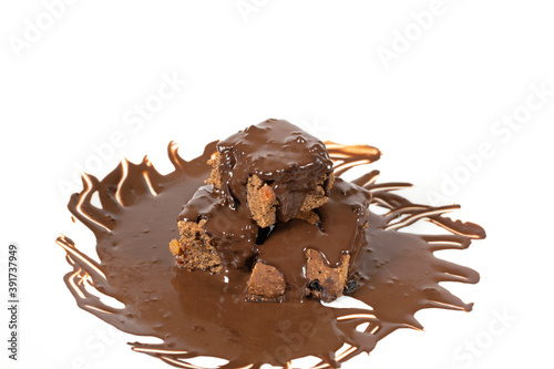 Chocolate dessert poured with chocolate isolated on a white background