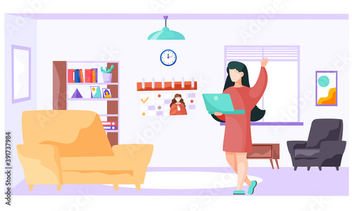 Woman is standing with laptop in the living room near sofa and watching video about virus covid-19 and its prevention. Broadcast about the need to prevent the spread of coronavirus. Stay at home