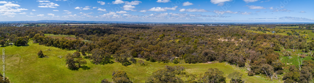Wide narrow banner aerial panorama of Australian green countryside on bright sunny day